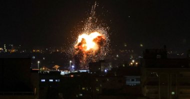 Fire and smoke rise above buildings in Gaza City as Israel launched air strikes on the Palestinian enclave, Jan. 27, 2023. (AFP Photo)