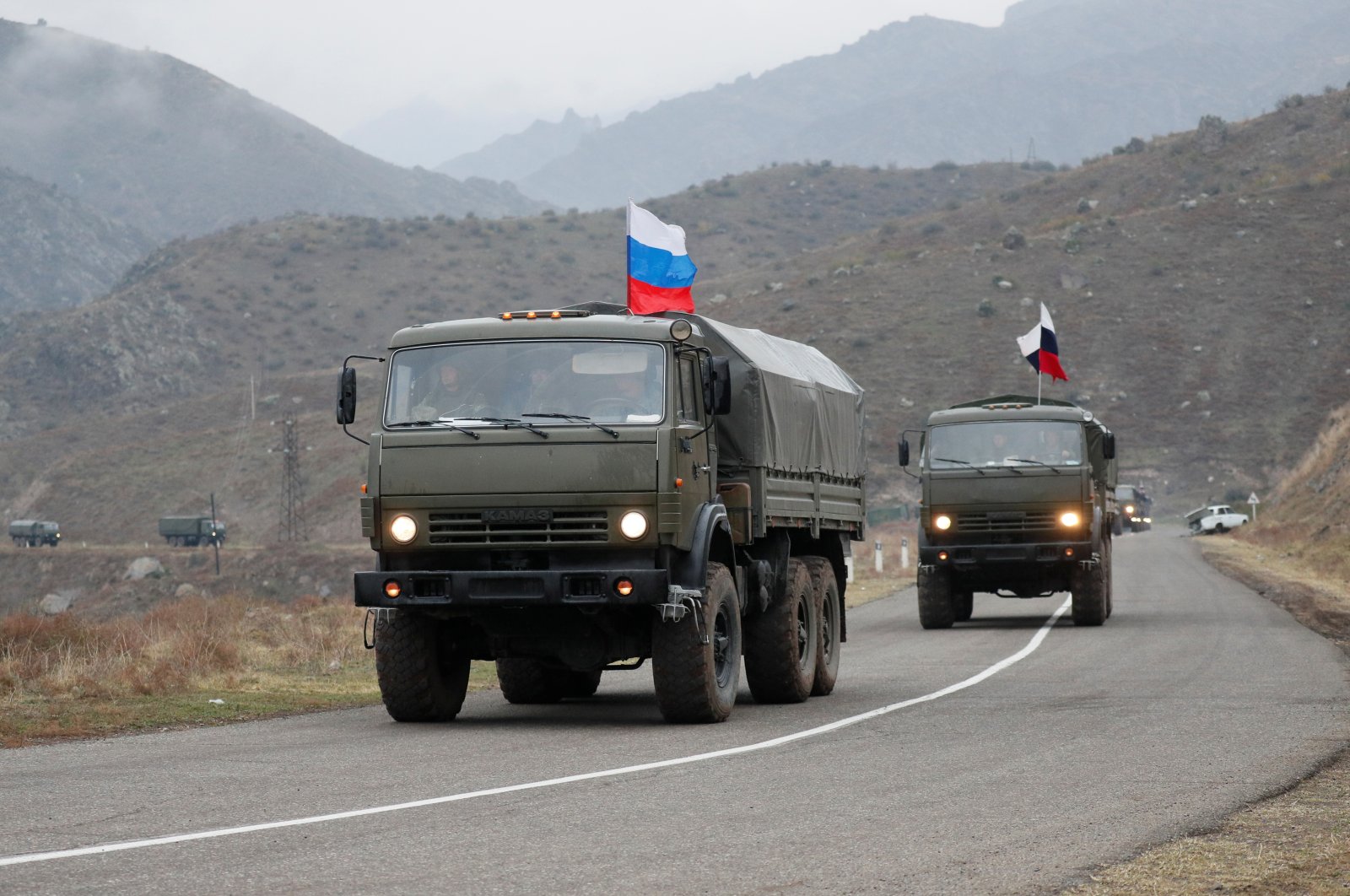 Military vehicles of the Russian peacekeeping forces drive along a road near Lachin in the region of Karabakh, Azerbaijan, Nov. 13, 2020. (Reuters Photo)