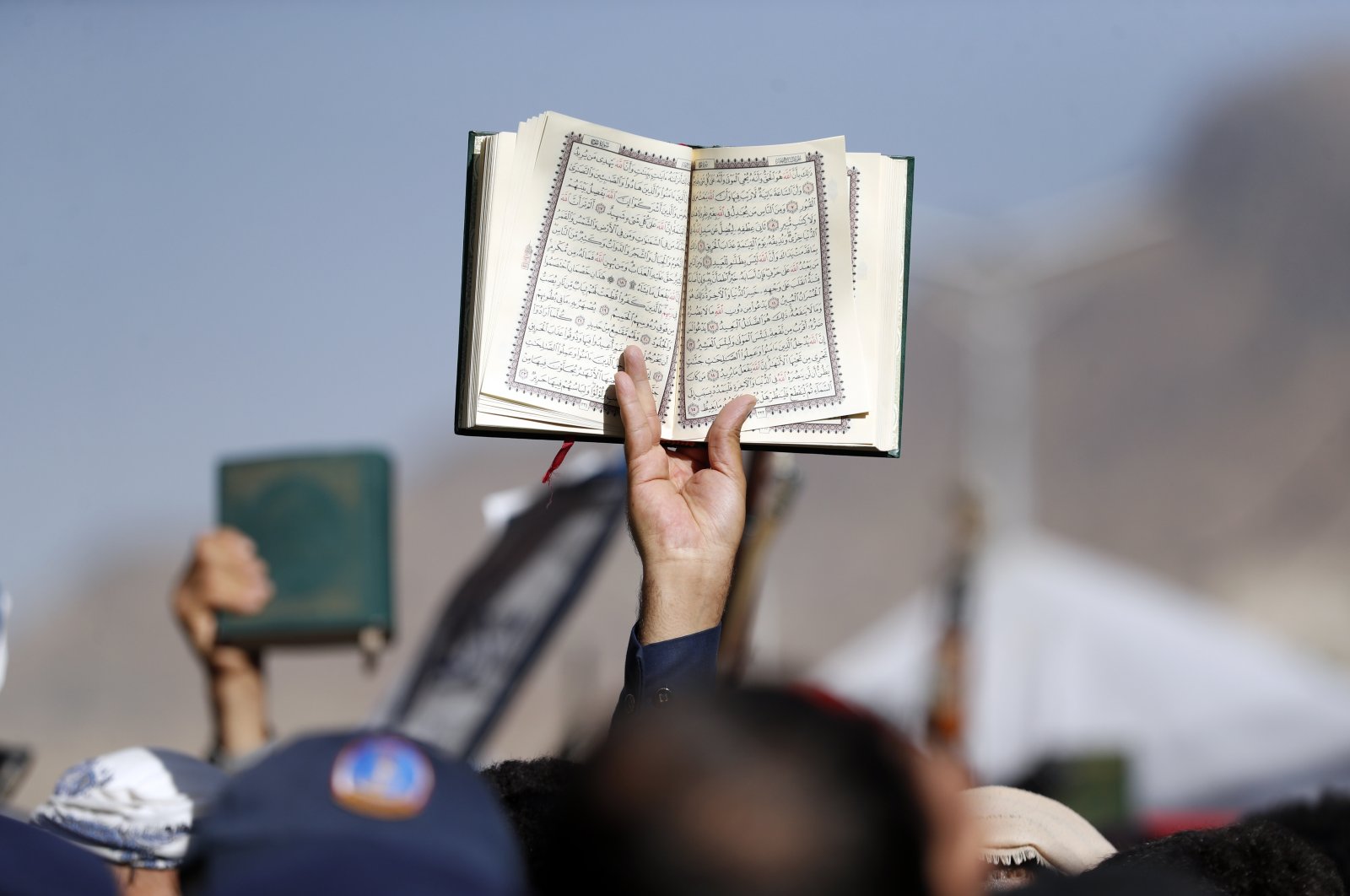 A Yemeni holds up a copy of the Quran during a protest against the burning of the holy book by a Swedish politician, in Sanaa, Yemen, Jan. 23, 2023. (EPA Photo)