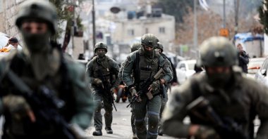 Israeli security personnel work at a scene where a suspected incident of shooting attack took place, just outside Jerusalem's Old City, Jan. 28, 2023. (Reuters Photo)