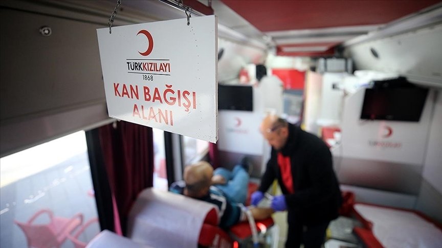 A man is seen donating blood in a Red Crescent (Kızılay) van in this undated photo. (AA Photo)