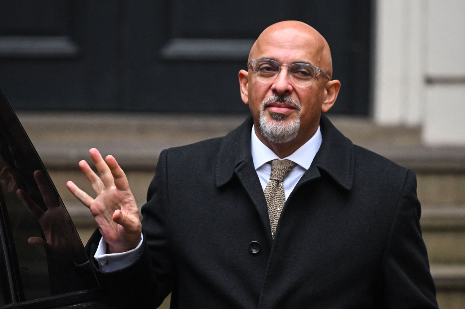 Britain&#039;s Minister without Portfolio and Conservative party chairperson Nadhim Zahawi waves as he leaves the party head office, London, U.K., Jan. 24, 2023. (AFP Photo)