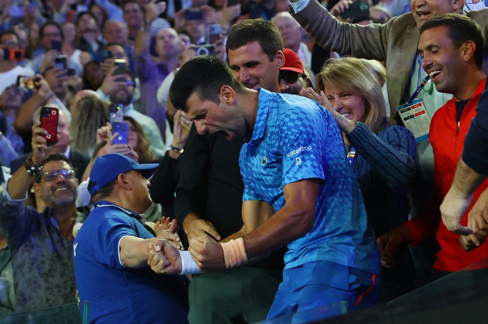 Serbia&#039;s Novak Djokovic celebrates with his team after winning his final match against Greece&#039;s Stefanos Tsitsipas, Melbourne, Australia, Jan. 29, 2023.