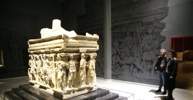 Visitors observe the Antakya Sarcophagus at the Hatay Archaeology Museum, Hatay, Türkiye, Dec. 26, 2022. (AA Photo)