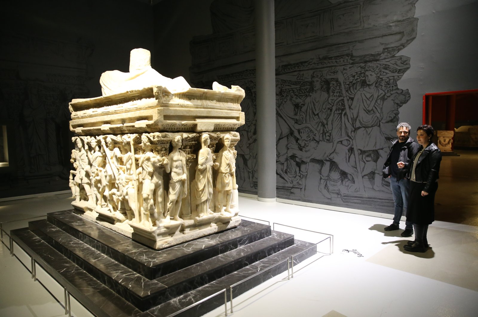 Visitors observe the Antakya Sarcophagus at the Hatay Archaeology Museum, Hatay, Türkiye, Dec. 26, 2022. (AA Photo)