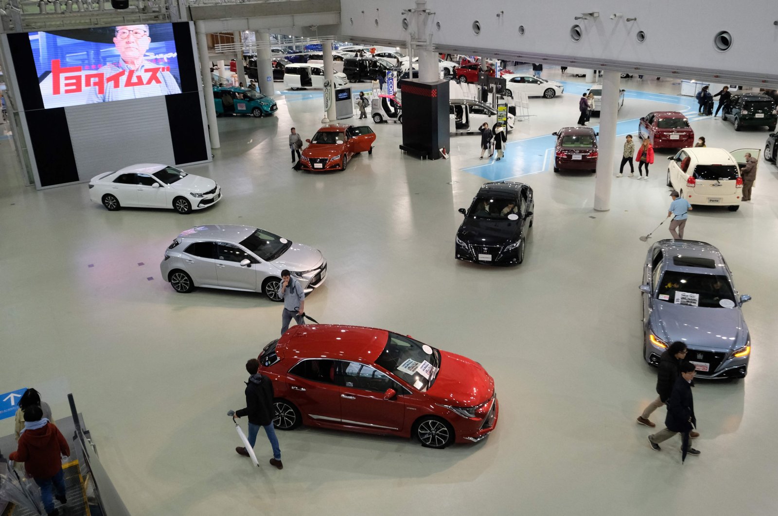 The photo taken on Feb. 6, 2019, shows people visiting a Toyota car showroom in Tokyo. - Japan&#039;s Toyota was the world&#039;s top-selling automaker in 2022, retaining its lead over German rival Volkswagen for the third year running, company data showed on Jan. 30, 2023. (AFP Photo)
