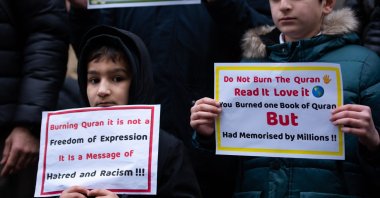 Young protestors hold placards during the demonstration against the Quran burning in Sweden, London, U.K., Jan. 28, 2023. (Getty Images Photo)