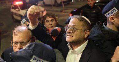 Israeli Minister of National Security Itamar Ben-Gvir speaks to bystanders as he walks to the site of a reported attack in a settler neighborhood in Israeli-annexed East Jerusalem, Palestine, Jan. 27, 2023. (AFP Photo)