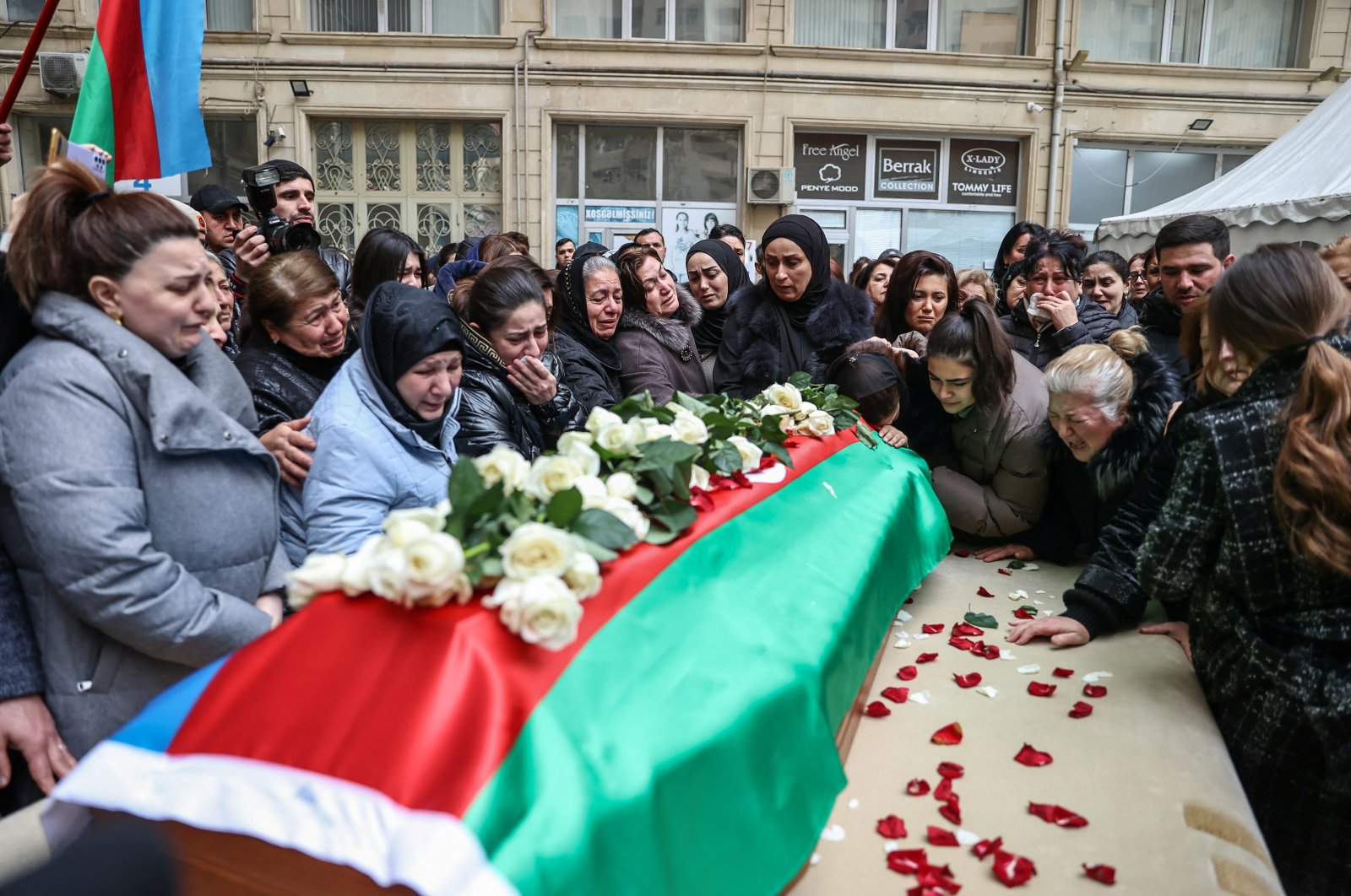 People gather around a coffin with the body of Orkhan Askerov, the security chief at Azerbaijan&#039;s embassy in Iran shot dead by a gunman in a recent attack, Baku, Azerbaijan, Jan. 30, 2023. (Reuters Photo)