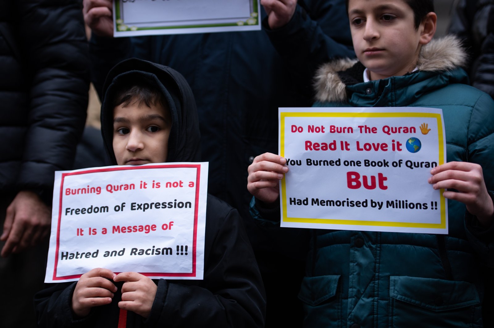 Young protestors hold placards during the demonstration against the Quran burning in Sweden, London, U.K., Jan. 28, 2023. (Getty Images Photo)