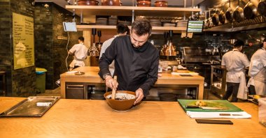 Famous chef Fatih Tutak prepares a dish at his Michelin star restaurant, in Istanbul, Türkiye, Nov. 7, 2020.