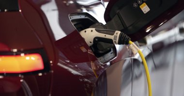 An electric car is charging in Munich, Germany, Oct. 22, 2021. (AP Photo)