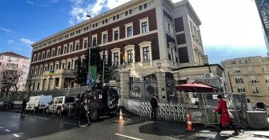 An armored vehicle is seen parked in front of the Consulate-General of Germany in Istanbul as pedestrians walk past the building, Türkiye, Feb. 1, 2023. (AA Photo)