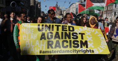 Activists and supporters take part during the Together Against Racism march protest on March 19, 2022, in Amsterdam, Netherlands. (Reuters File Photo)