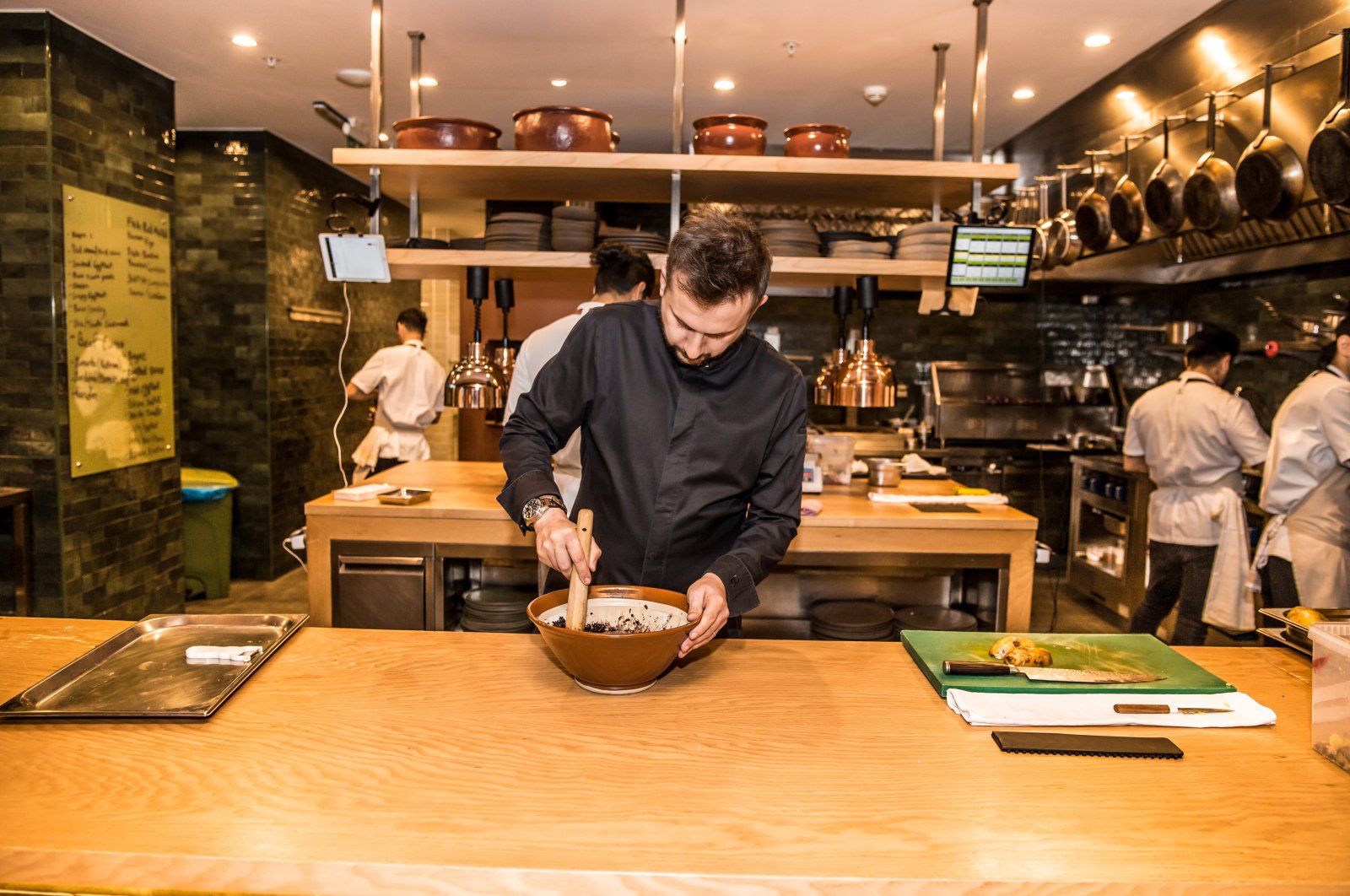 Famous chef Fatih Tutak prepares a dish at his Michelin star restaurant, in Istanbul, Türkiye, Nov. 7, 2020.