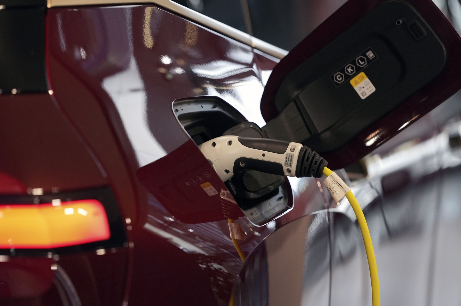 An electric car is charging in Munich, Germany, Oct. 22, 2021. (AP Photo)