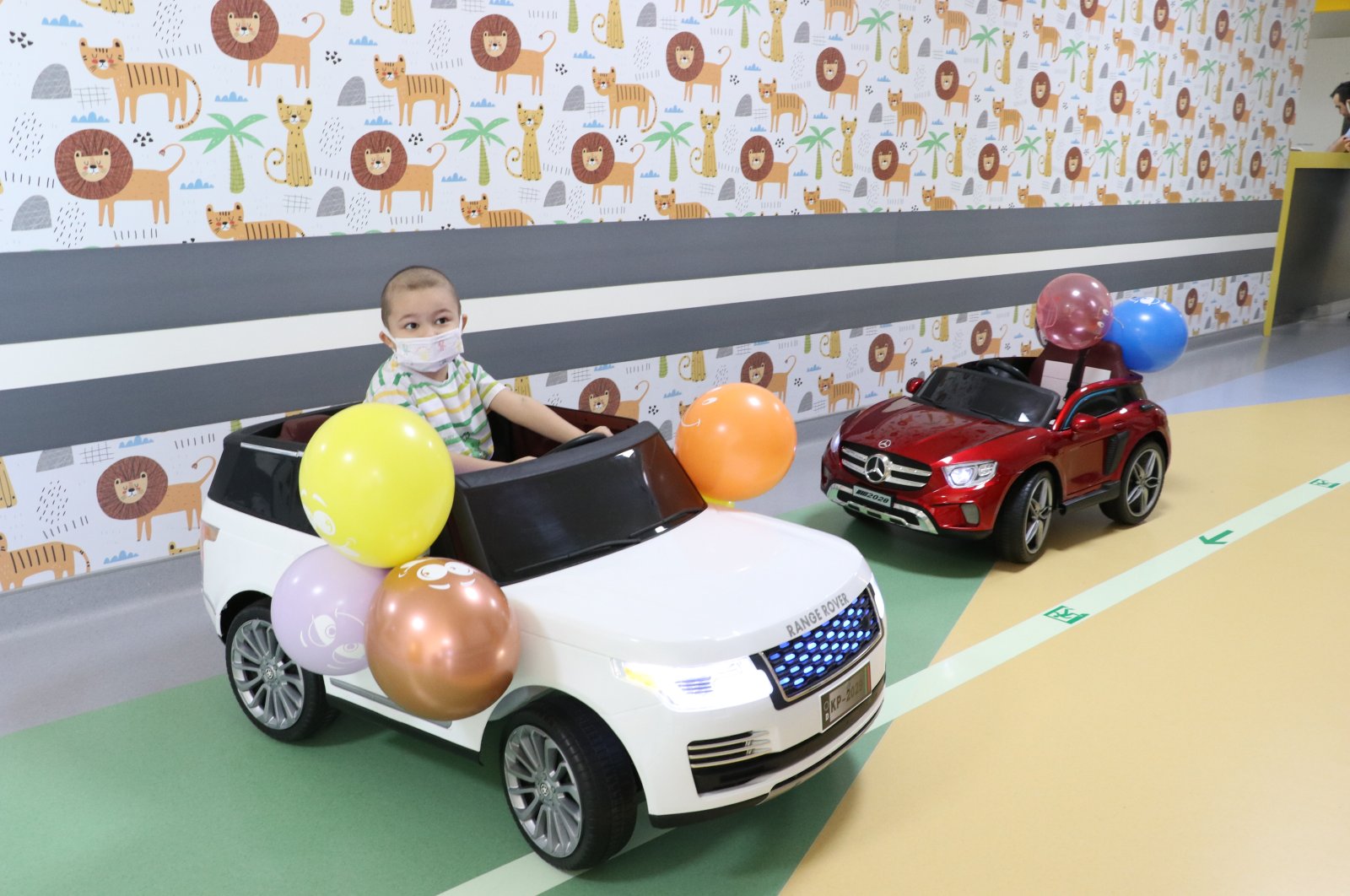 Children using ride-on cars are photographed at the oncology department of Erciyes University Hospital, Kayseri, Türkye, Feb, 1, 2023. (AA Photo)