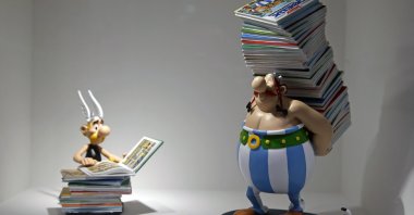 Figurines of characters of Asterix and Obelix created by French designer Uderzo are on display at the &quot;Uderzo, Comme Une Potion Magique&quot; (Uderzo, Like A Magic Potion) exhibition at the Maillol Museum, Paris, France, May 25, 2021. (Getty Images Photo)