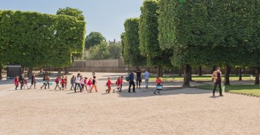 School children on a field trip to picnic at the Luxembourg Palace and Gardens, a popular and historic park in the Montparnasse neighborhood in Paris, May 18, 2018. (Shutterstock File Photo)
