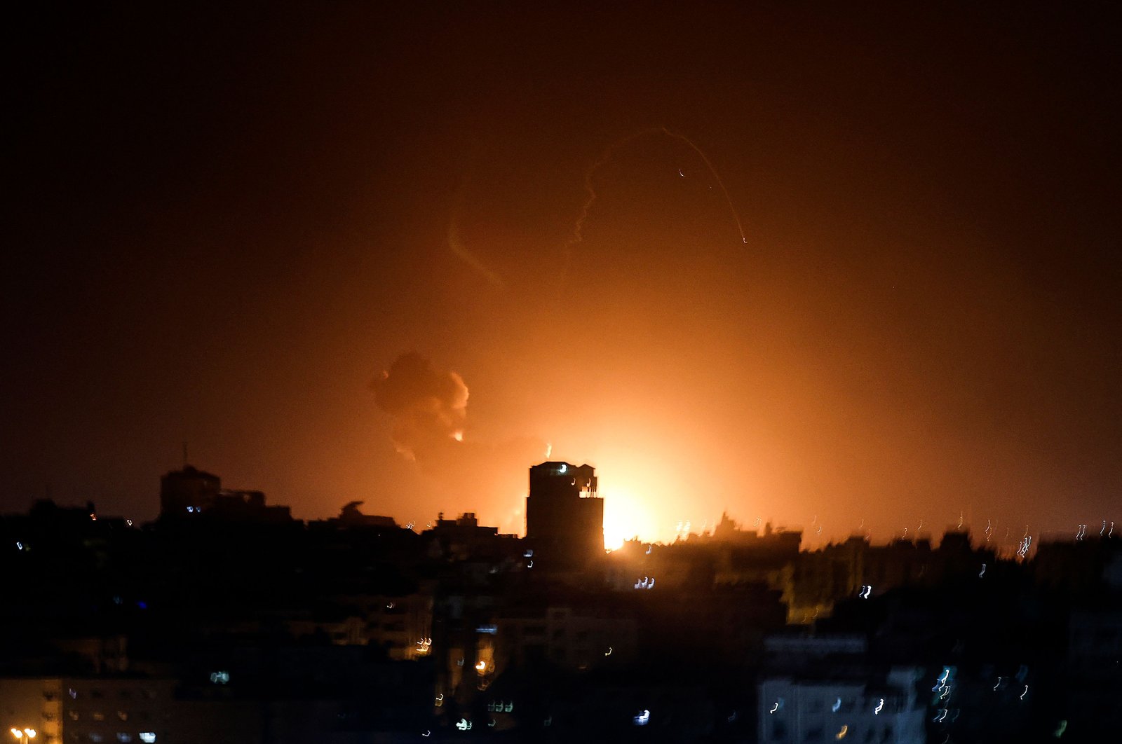 Fire and smoke rise above buildings in Gaza City following Israeli air strikes, Gaza, Palestine, Feb. 2, 2023. (AFP Photo)