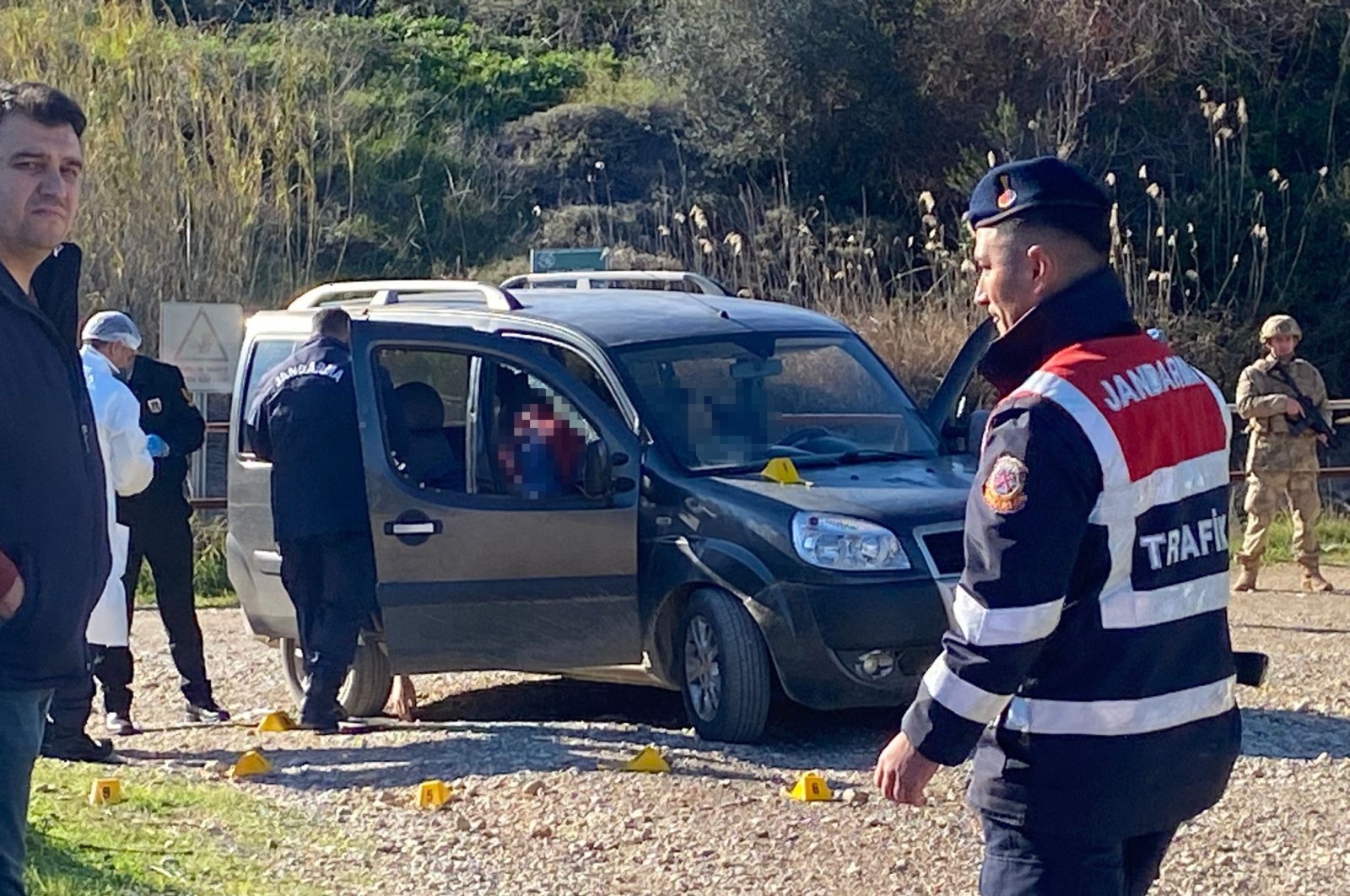 Gendarmerie officers investigate the scene, in Antalya, southern Türkiye, Feb. 2, 2023. (İHA Photo) 