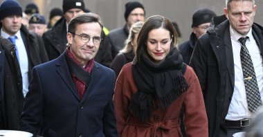 Sweden's Prime Minister Ulf Kristersson (L) and Finland's Prime Minister Sanna Marin (R) walk from the prime minister's official residence The Sager House to the government headquarters Rosenbad in Stockholm, Sweden, Feb. 2, 2023. (EPA Photo)