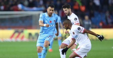 Trabzonspor's Trezeguet (L) in action against Antalyaspor players at Şenol Güneş Sports Complex, Trabzon, Türkiye, Feb. 1, 2023. (AA Photo)