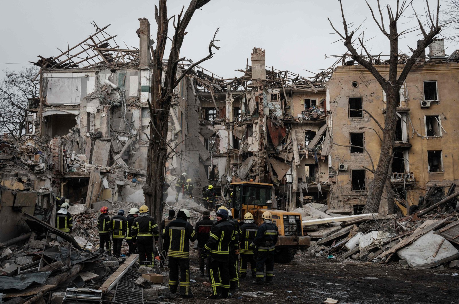 Firefighters work among debris of a destroyed building by a rocket strike, Kramatorsk, Ukraine, Feb. 2, 2023. (AFP Photo)