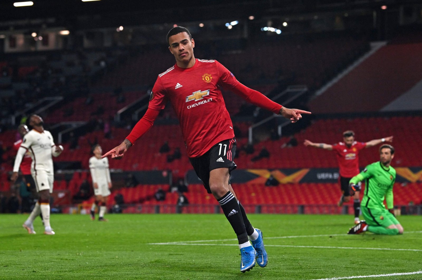 Manchester United&#039;s English striker Mason Greenwood celebrates after scoring their sixth goal during the UEFA Europa League semifinal first leg match against Roma at Old Trafford stadium, Manchester, U.K., April 29, 2021. (AFP Photo)