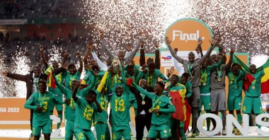 Senegal players celebrate with the trophy after winning the African Nations Championship in the final against Algeria at the Nelson Mandela Stadium, Algiers, Algeria, Feb. 4, 2023. (Reuters Photo)