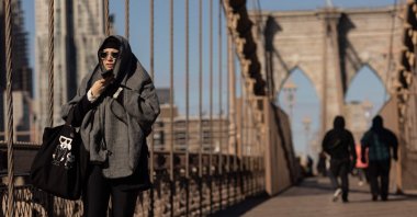 People walk on the Brooklyn Bridge amid subzero temperatures in New York, U.S., Feb. 4, 2023. (AFP Photo)