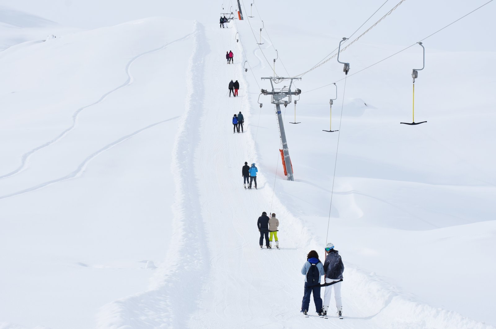Professional and novice skiers skiing with snowboards at Merga Bütan Ski Center, Hakkari, Türkiye, Feb. 5, 2023. (AA Photo)