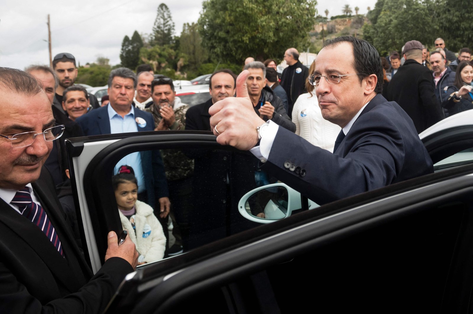 Former Greek Cypriot Foreign Minister and presidential candidate Nikos Christodoulides greets supporters at the Geroskypou polling center in the western Paphos district, Greek Cypriot administration, Feb. 5, 2023. (AFP Photo)