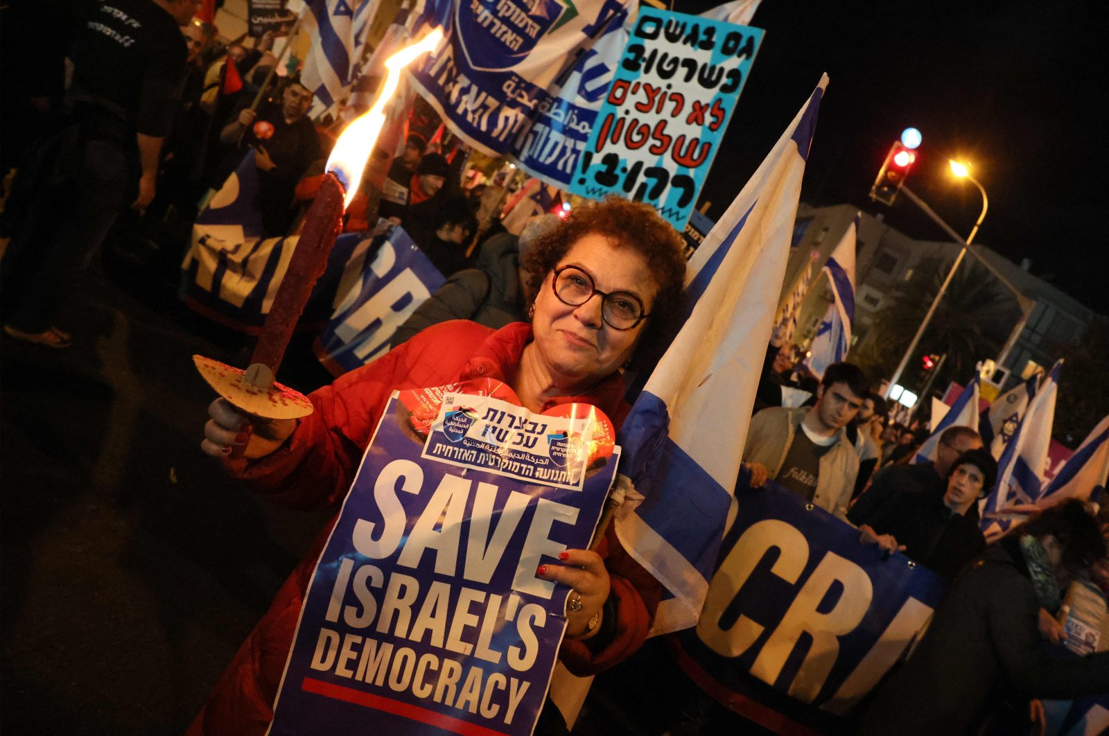 Israeli protesters attend a rally against controversial government plans to give lawmakers more control of the judicial system, Tel Aviv, Israel, Feb. 4, 2023. (AFP Photo)
