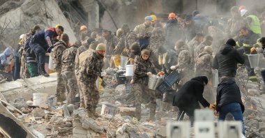 Search and rescue teams and the Provincial Police Department work on a building demolished during the quake, Diyarbakir, Türkiye, Feb. 6, 2023. (AA Photo)