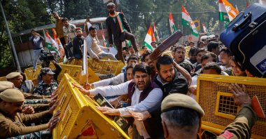 Activists of the youth wing of India's main opposition Congress party try to break a police barricade during a protest against what they say are investments by Life Insurance Corporation (LIC) and State Bank of India (SBI) in Adani Group, in New Delhi, India, Feb. 6, 2023. (Reuters Photo)