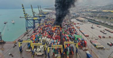 Dark smoke rises after a fire broke out among containers toppled at a major port in the Mediterranean coastal city of Iskenderun following an earthquake, southern Türkiye, Jan. 6, 2023. (AA Photo)