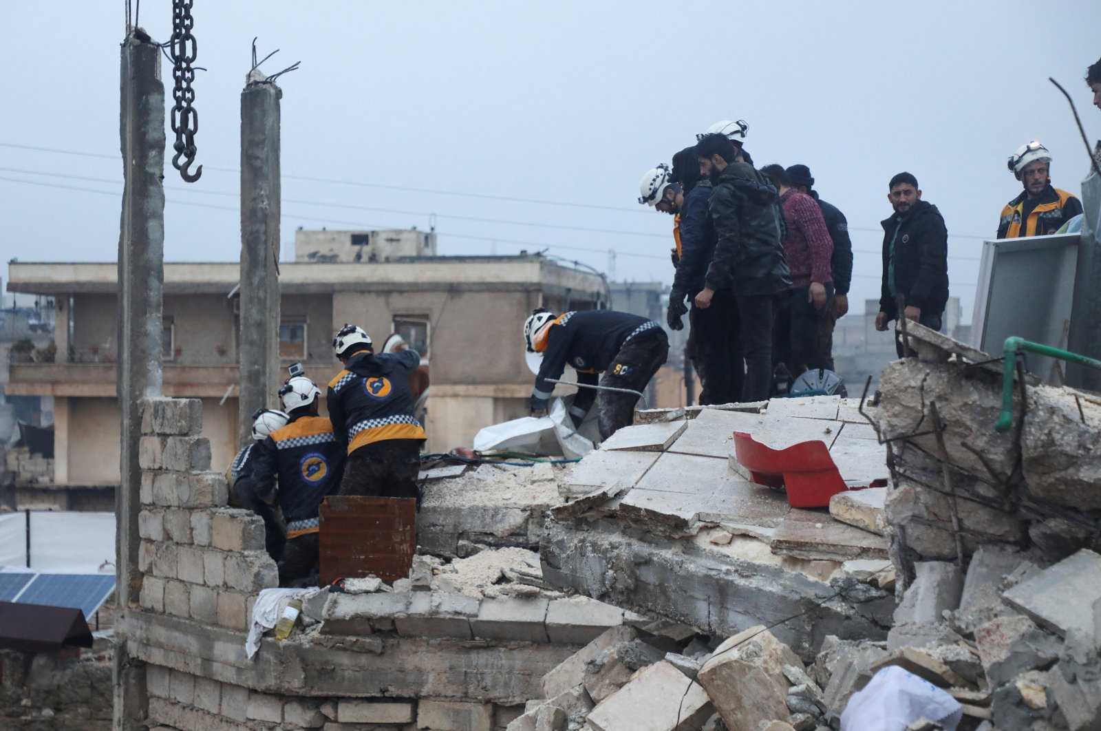 Rescuers search for survivors under the rubble of a damaged building, following an earthquake, in opposition-held Azaz, Syria, Feb. 6, 2023. (Reuters Photo)