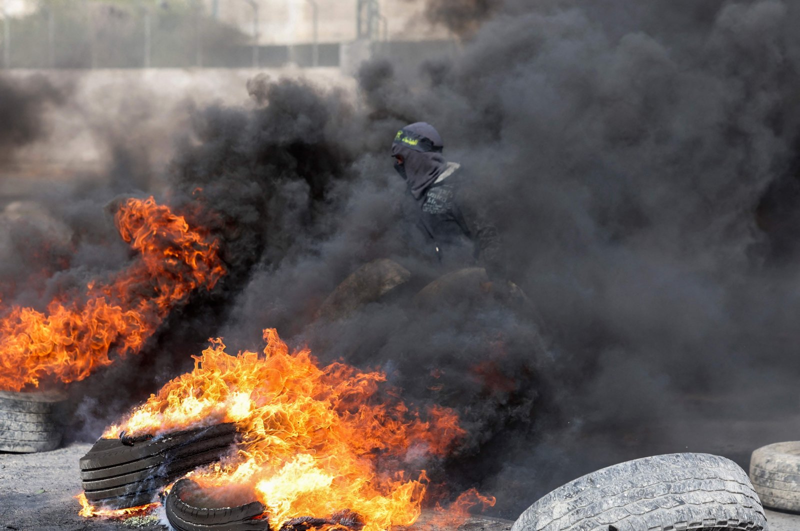 Palestinian protesters burn tires to block a road leading into Jericho in the occupied West Bank, Palestine, Feb. 6, 2023. (AFP Photo)