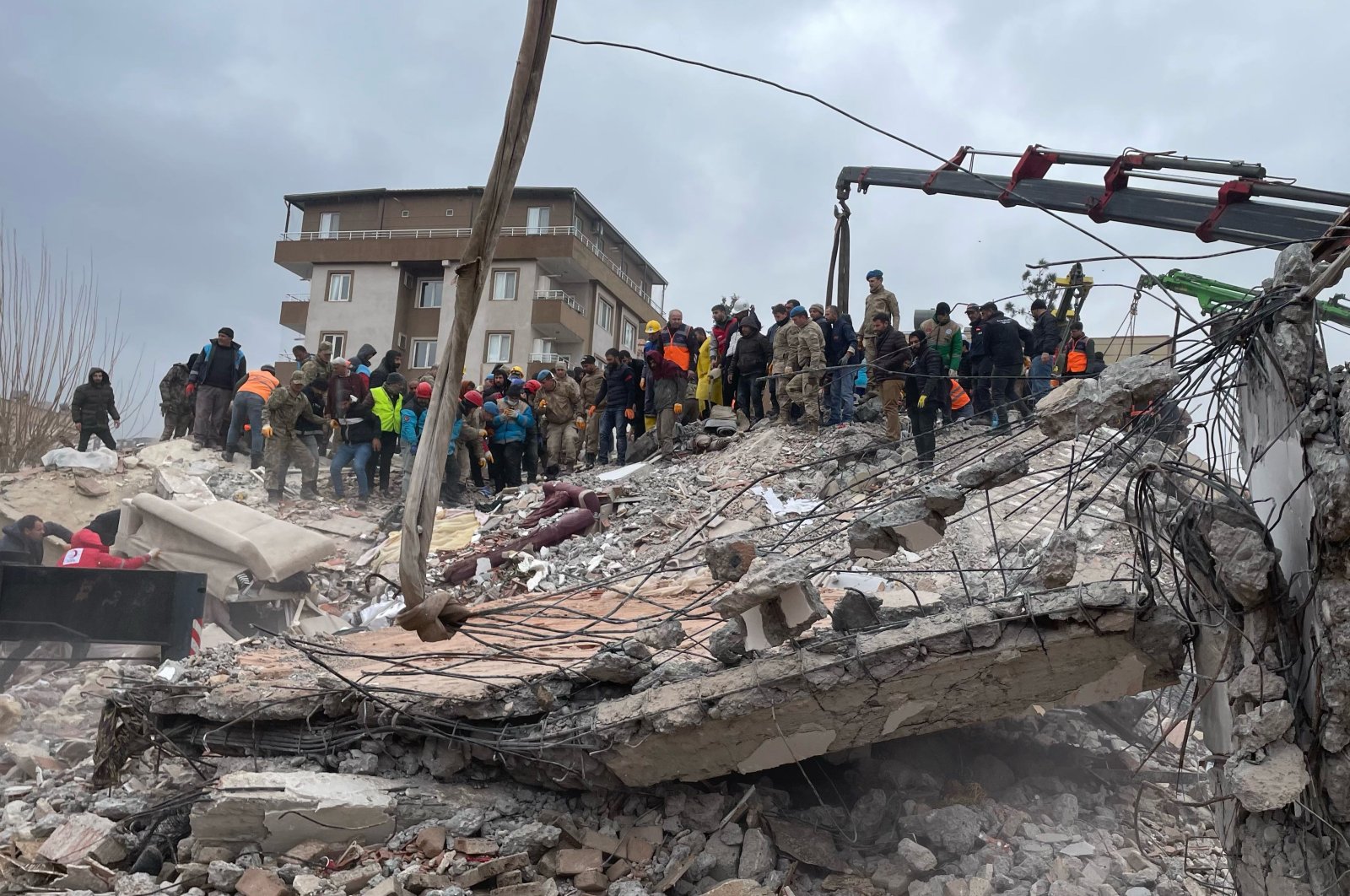 Rescuers search for survivors under the rubble following an earthquake in Kahramanmaraş, central Turkey, Feb. 6, 2023. (AA Photo)