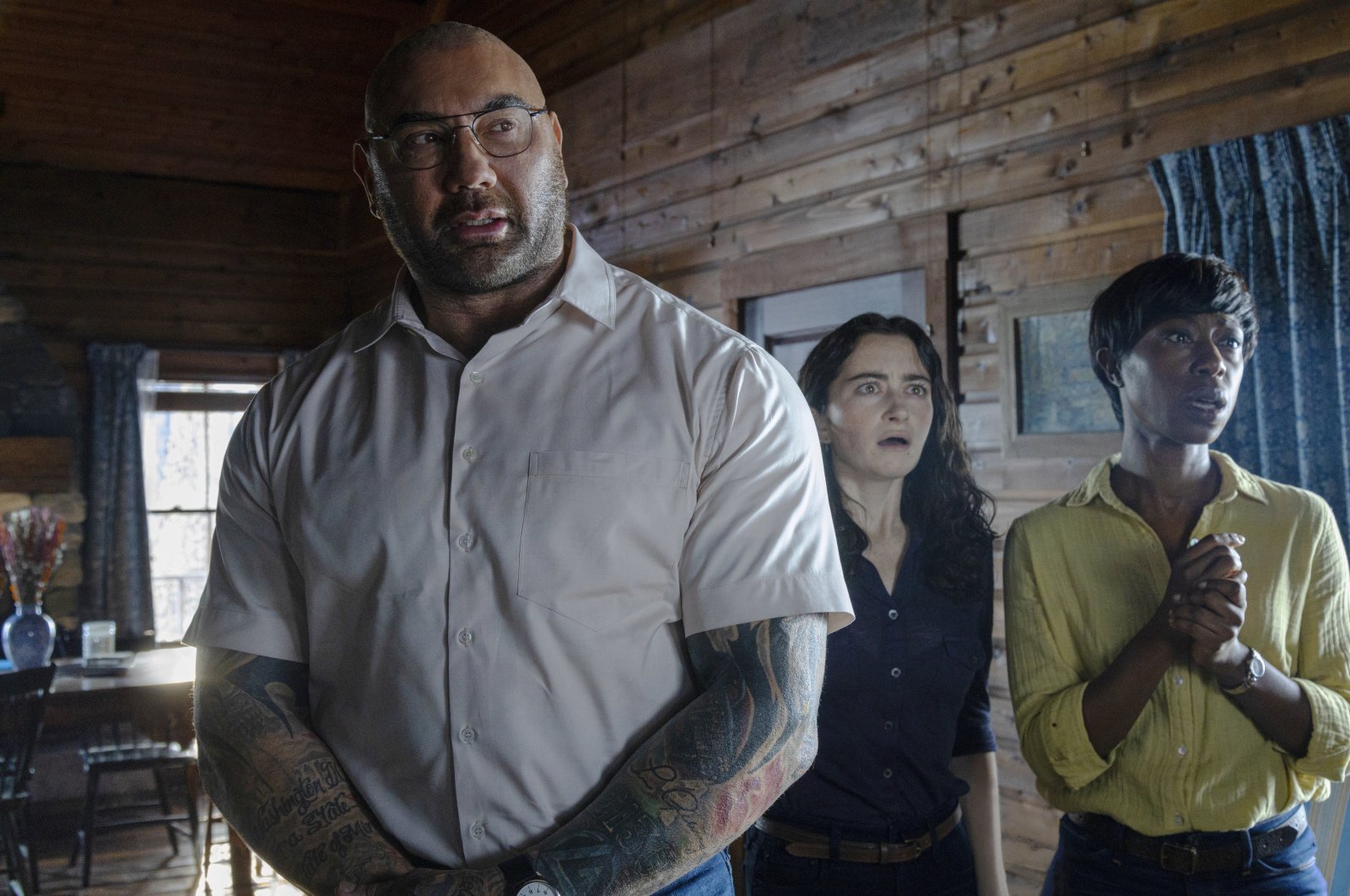 This image released by Universal Pictures shows (L-R) Dave Bautista, Abby Quinn, and Nikki Amuka-Bird in a scene from &quot;Knock at the Cabin.&quot; (AP Photo)