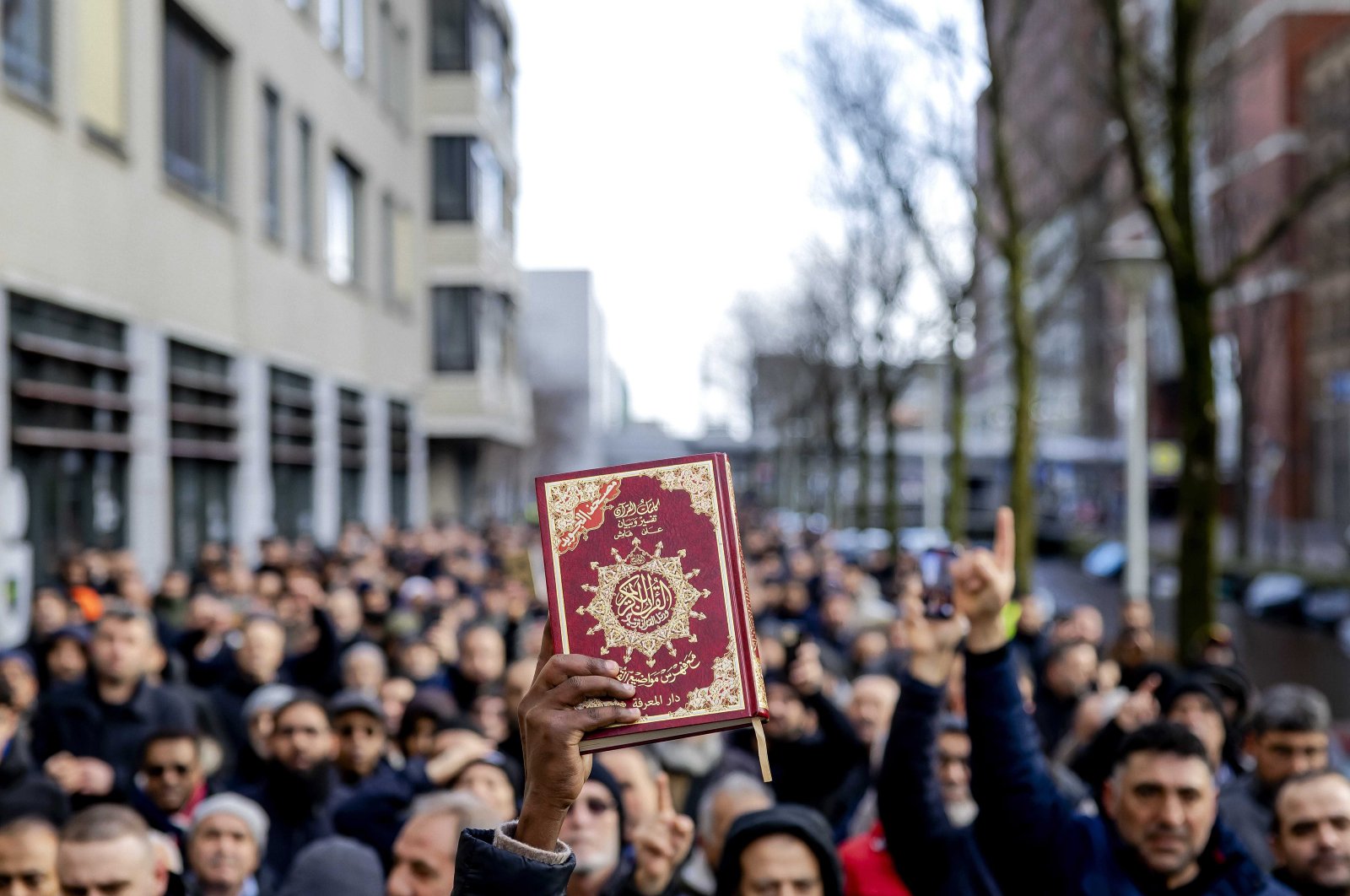 A person holds up a copy of Islam&#039;s holy book Quran as people take part in a rally to protest against hatred toward Muslims, in The Hague, Netherlands, Feb. 5, 2023. (EPA Photo)