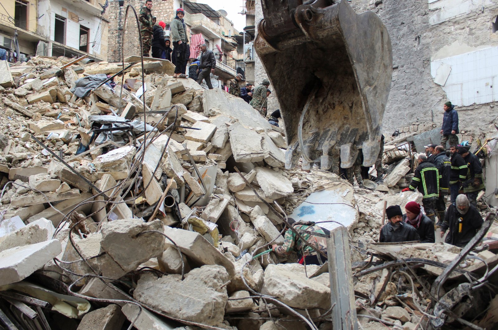 Rescuers search for survivors under the rubble, following an earthquake, in Aleppo, Syria, Feb. 6, 2023. (Reuters Photo)