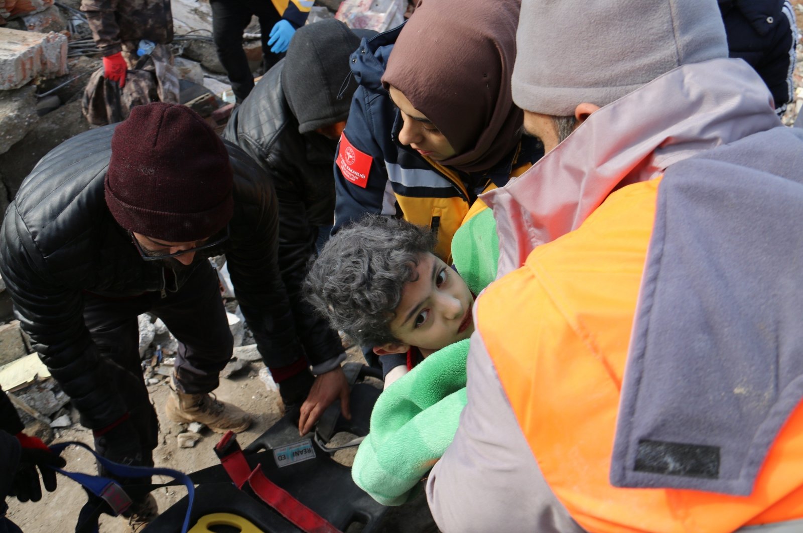 Eight-year-old boy Muhammed is pulled out of the wreckage following the deadly earthquake in Türkiye&#039;s Kahramanmaraş province on Feb. 7, 2023. (IHA Photo)