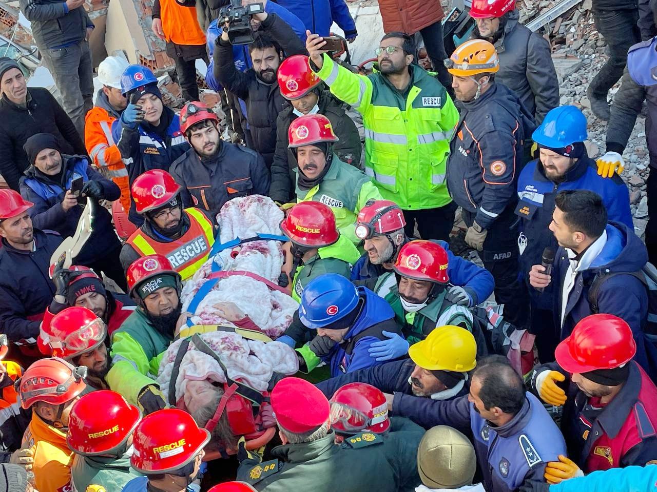 Pakistani search and rescue teams working in Adıyaman rescue a 50-year-old woman 57 hours after the quake struck, Türkiye, Feb. 8, 2023. (AA Photo)