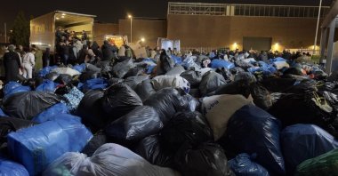 People are seen loading aid for to be sent to earthquake areas. (AA File Photo)