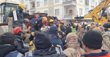 Emergency personnel and locals search for survivors at the site of a collapsed building in the aftermath of a major earthquake, Kahramanmaras, Türkiye, Feb. 8, 2023. (DHA Photo)