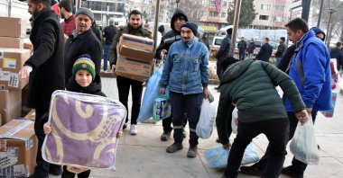 Trucks full of humanitarian aid from Sinop are offloaded in the earthquake zone, Kahramanmaraş, Türkiye, Feb. 8, 2023. (AA Photo)