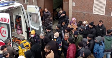 Relatives of victims gather around an ambulance as they wait in front of a morgue section of the state hospital in the aftermath of a major earthquake in Diyarbakir, Türkiye, Feb. 8, 2023. (EPA Photo)
