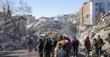 People work at the site of a collapsed building, in the aftermath of the deadly earthquake, Kahramanmaraş, Türkiye, Feb. 8, 2023. (AA Photo)